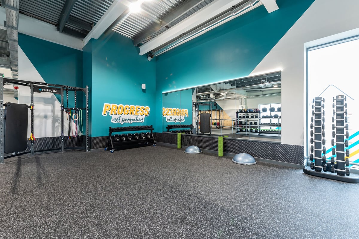 PureGym Bicester: Functional training area, resistance bands, free weights, weighted sleds, rubberized flooring.