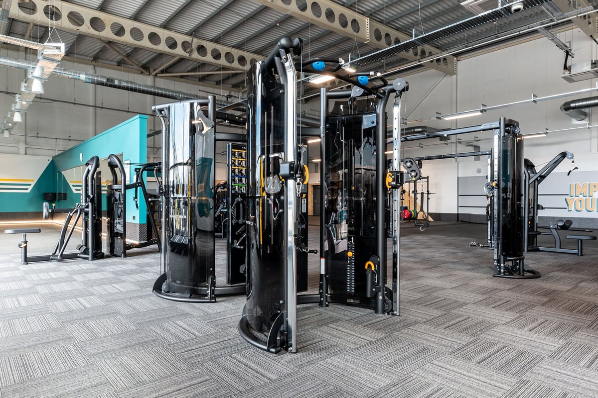 PureGym St Ives Cambridgeshire: Fitness studio interior with resistance machines, cable crossovers, and rubberized flooring.