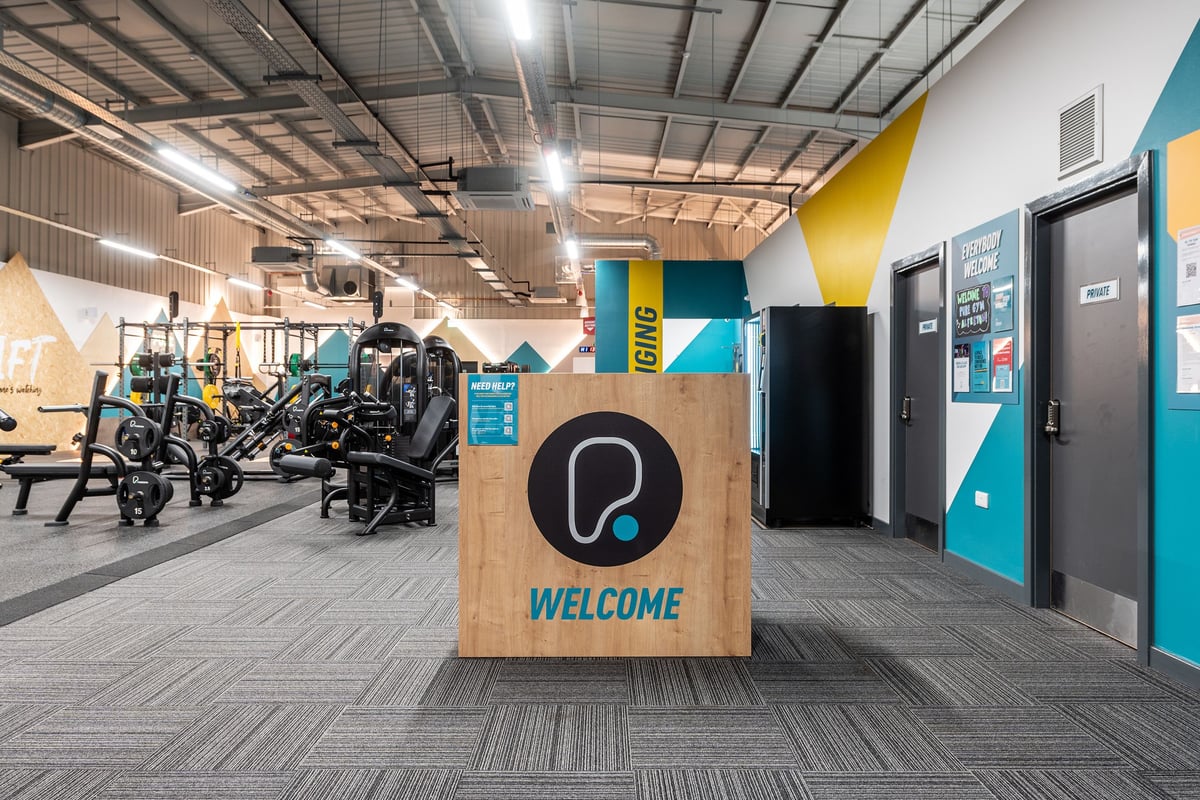 PureGym Alfreton: Weight machines, cardio equipment, free weights, and mirrored walls in a modern gym setting.
