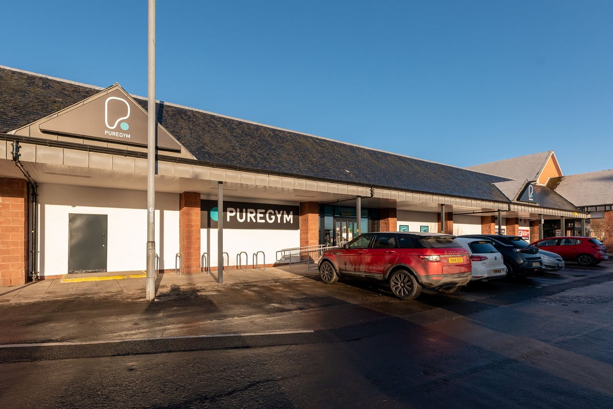 PureGym Alloa: Pure Gym exterior with parking spaces and signage visible.