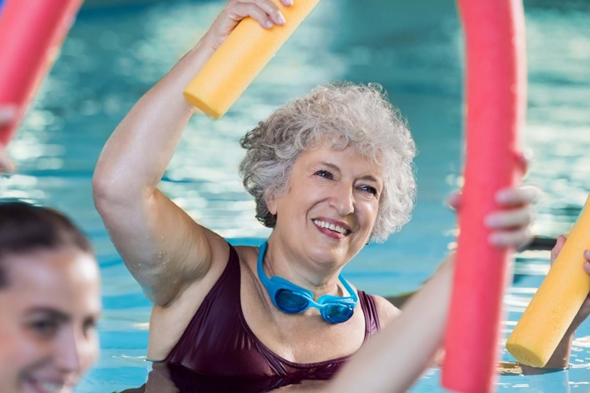Smiling lady in pool