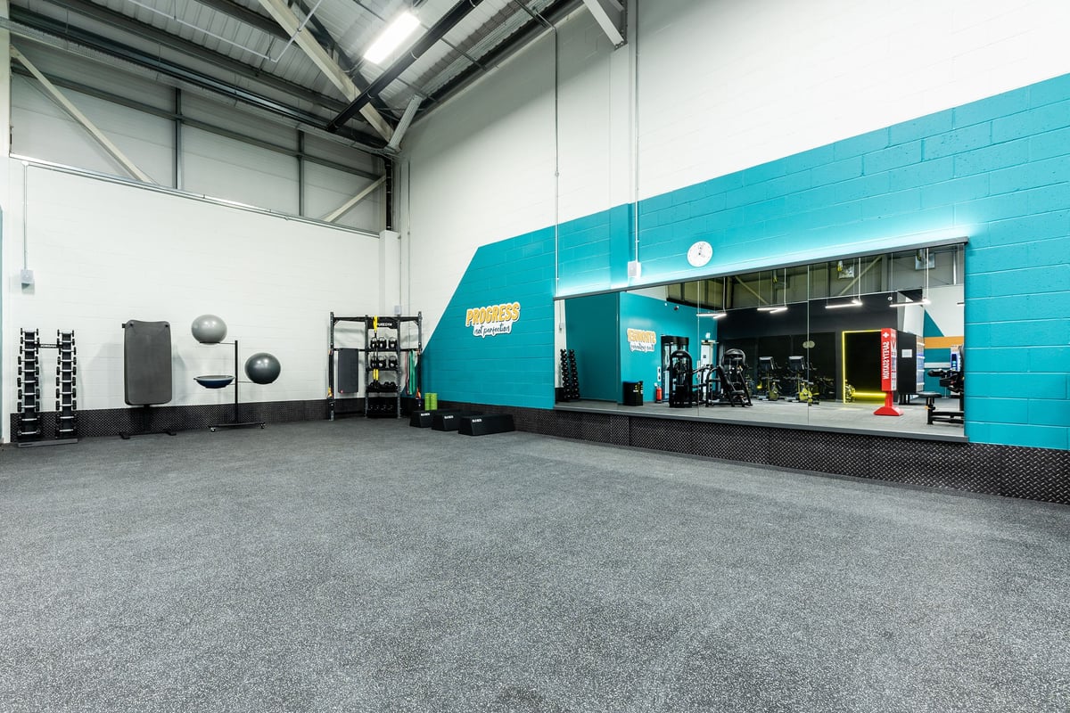 PureGym Broadstairs Westwood Gateway Retail Park: Gym interior with weight racks, cardio machines, and rubberized flooring.