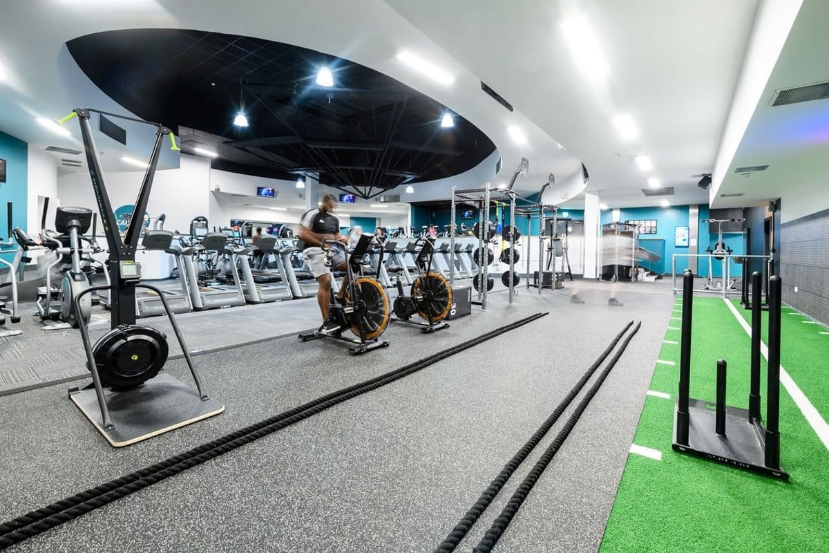 PureGym Northampton Central: Resistance machines, cardio equipment, free weights, turf area with functional training setup.