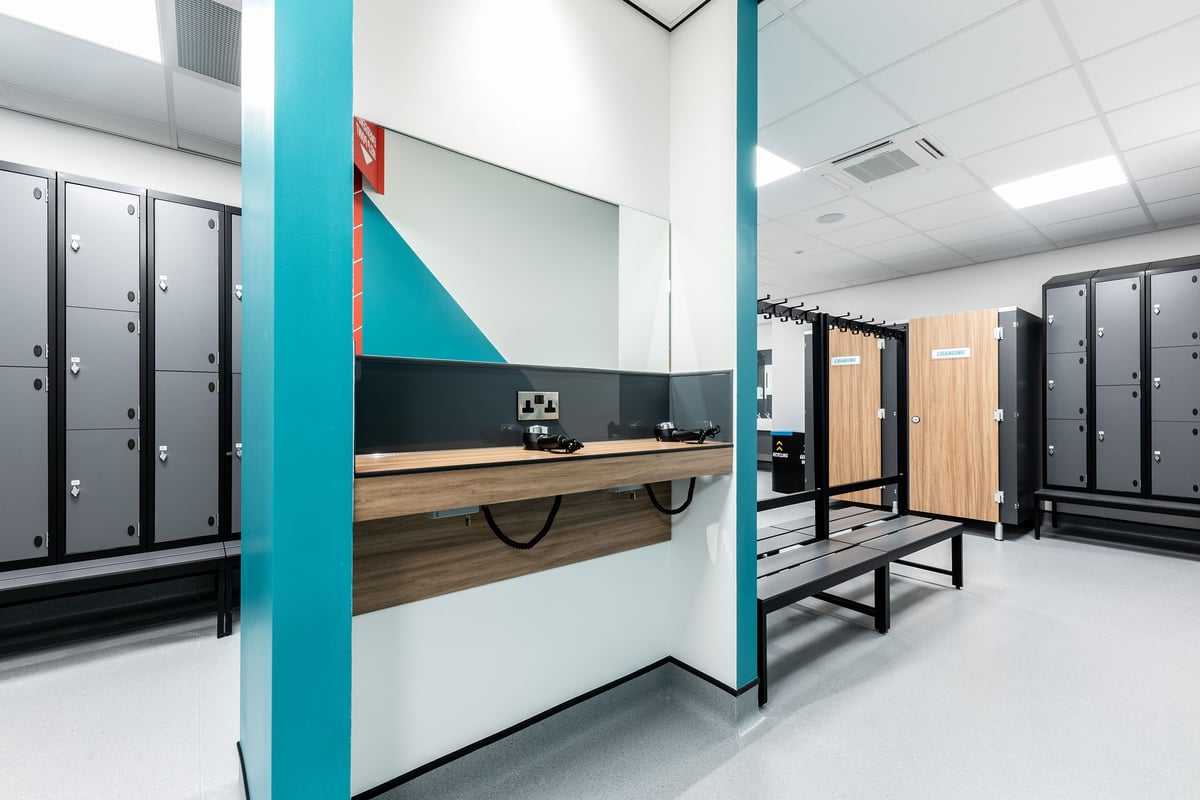 PureGym Maidenhead: Lockers, benches, reception counter in contemporary colours and materials.