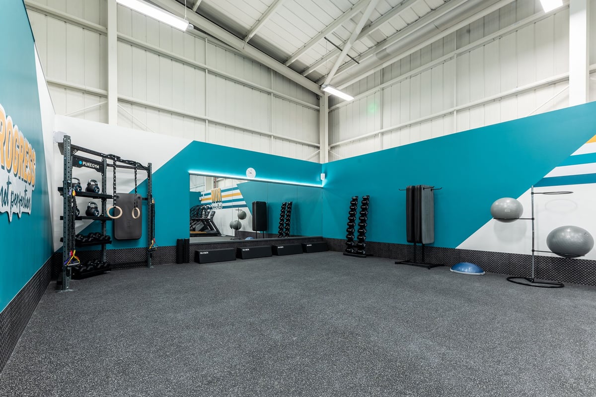 PureGym Eastbourne: Rubberized gym floor, squat racks, weight plates, fitness balls, resistance bands.