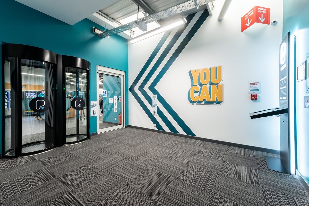 PureGym Cardiff Western Avenue: Entrance area with vending machines and the motivational text "YOU CAN".