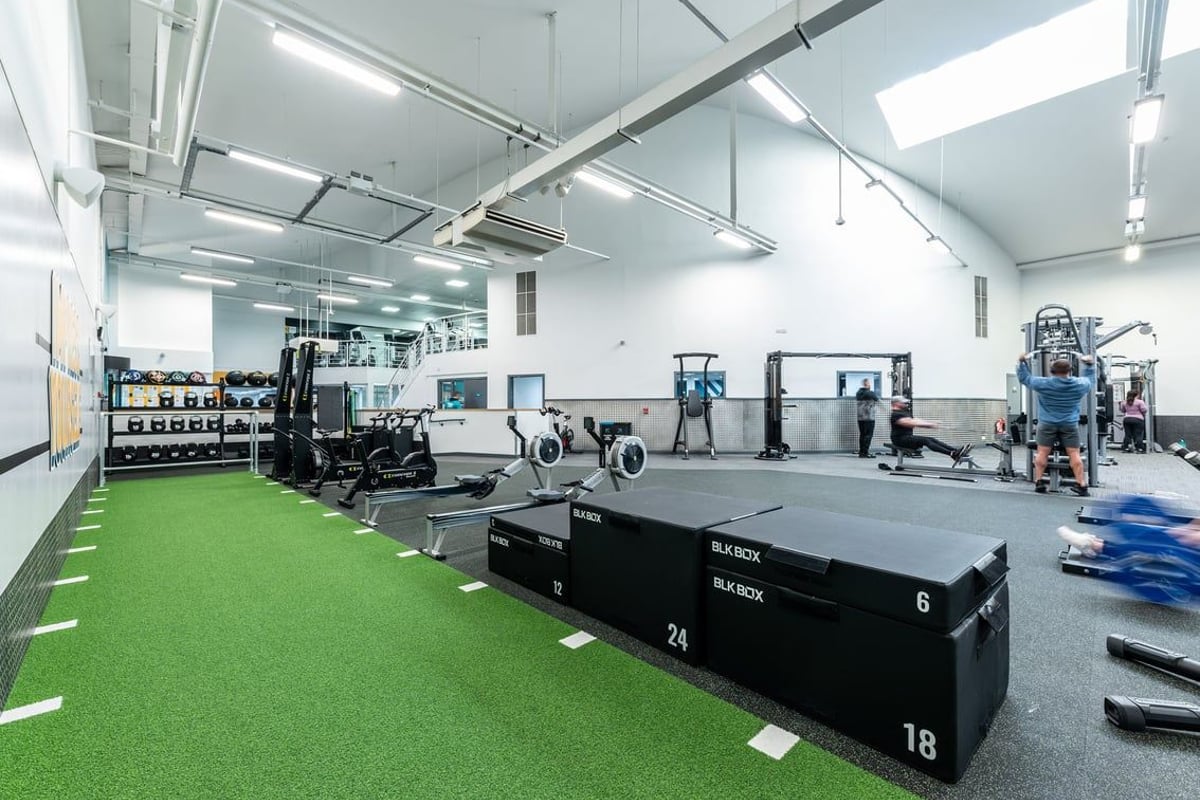 PureGym Bangor Northern Ireland: Strength equipment, plyometric boxes, turf flooring, weight racks, and open floor space.
