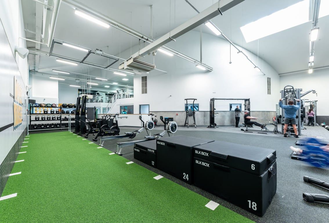 PureGym Bangor Northern Ireland: Strength equipment, plyometric boxes, turf flooring, weight racks, and open floor space.