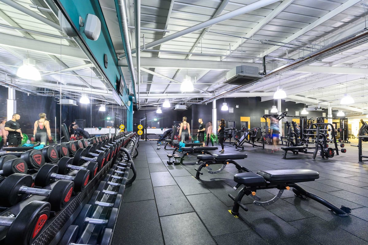 PureGym Glasgow Shawlands: Rows of resistance machines, benches, and weightlifting equipment in a gym studio.
