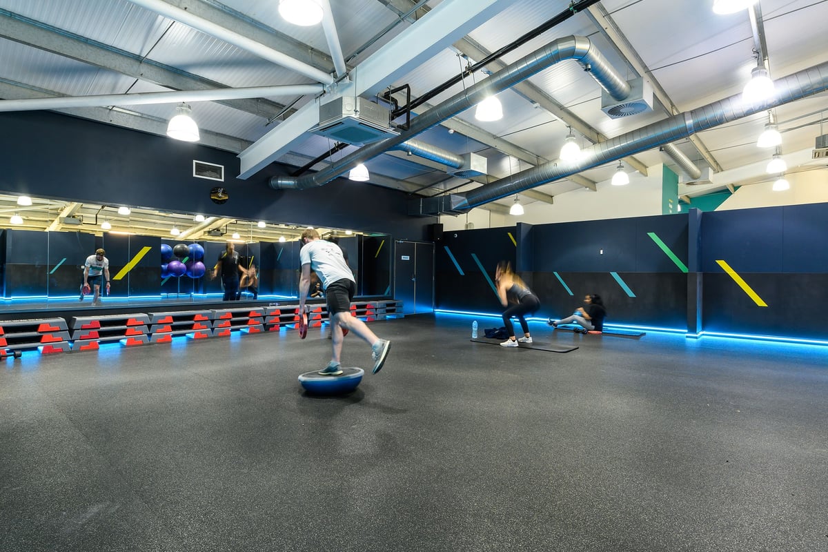 PureGym Oxford Templars Shopping Park: Indoor gym with padded floors, climbing walls, obstacle courses, and exercise balls.
