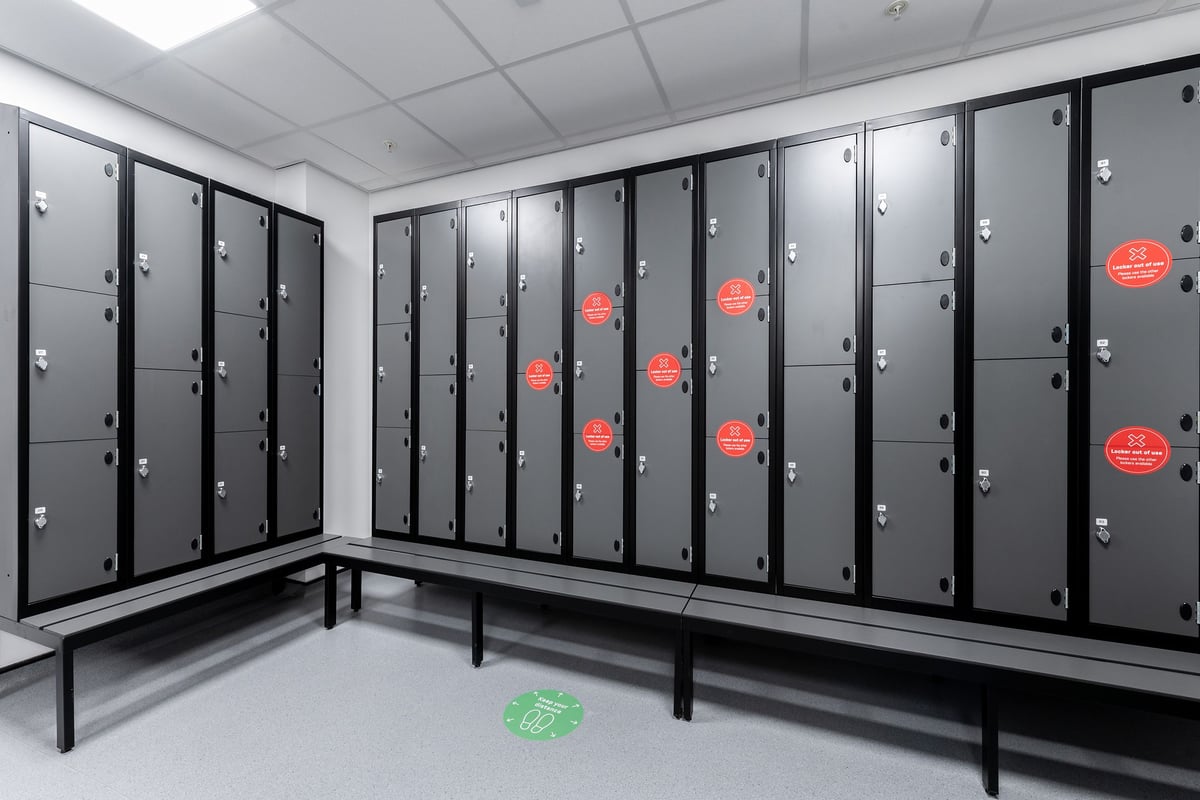 PureGym Reading Calcot changing room: Rows of lockers and benches