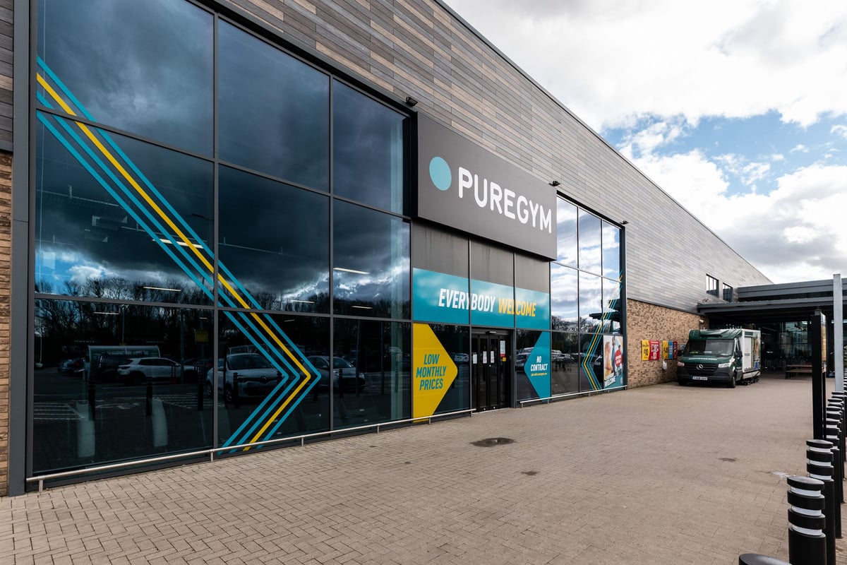 PureGym St Ives Cambridgeshire: Gym exterior with branding, windows showcasing equipment inside.