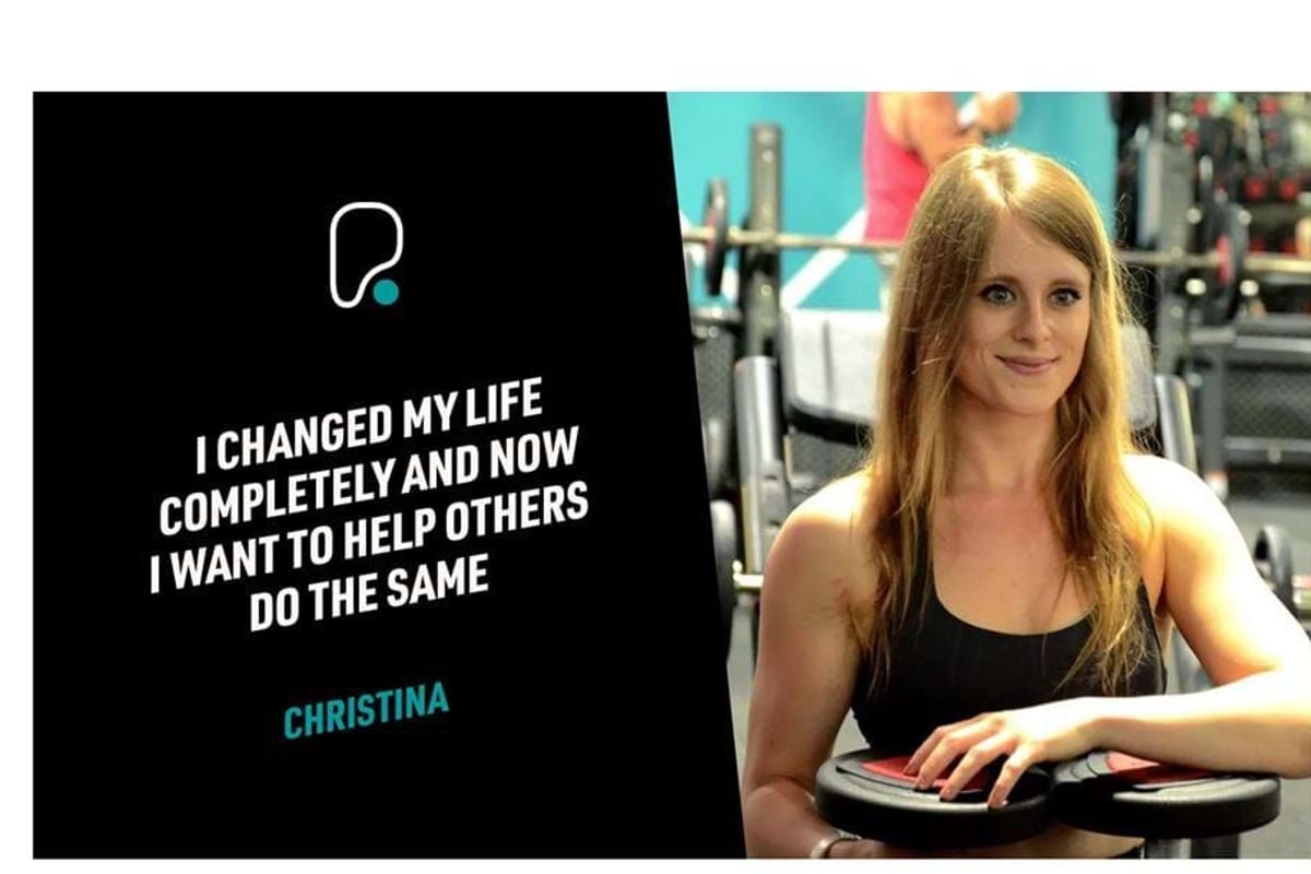 Woman in gym resting arms on weights beside text about changing life and helping others