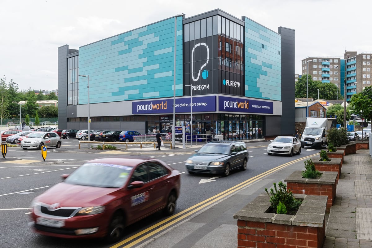 PureGym Leeds Regent Street: Retail store faÃ§ade with signage and parking lot.