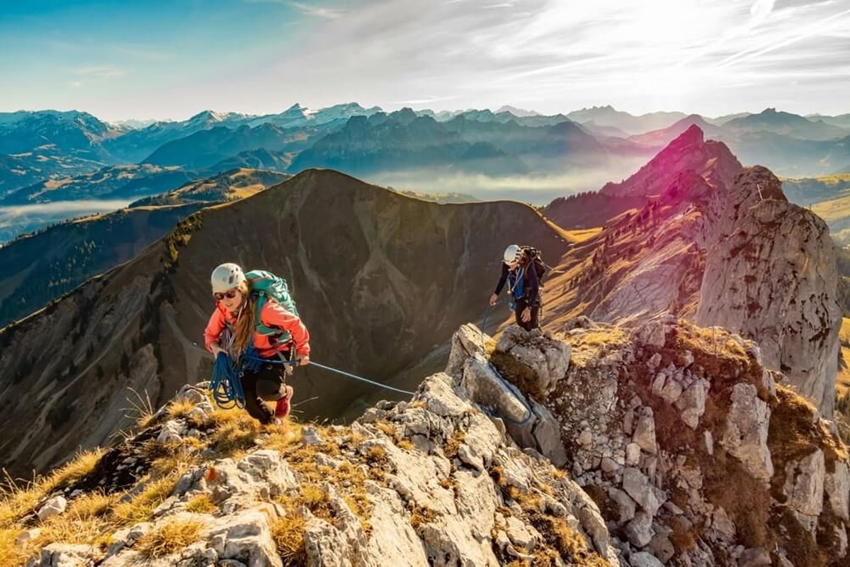 Person hiking on top of a mountain