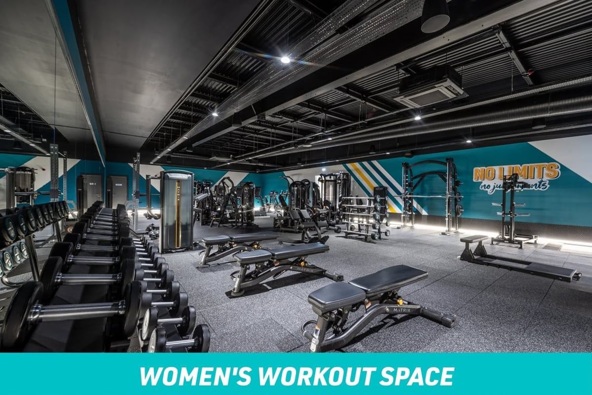 PureGym Manchester Cheetham Hill Women's Workout Space: Free weights area with benches and dumbbells