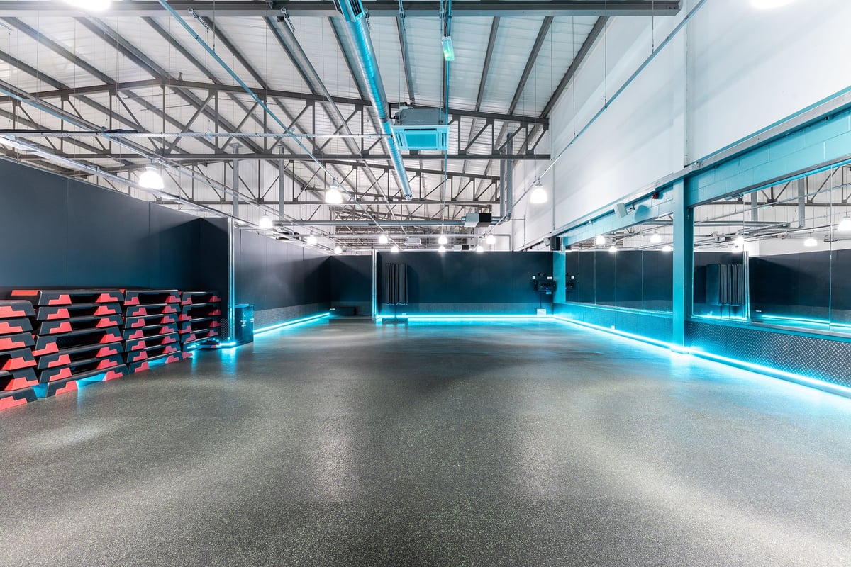 PureGym Wolverhampton Bentley Bridge: Rows of cardiovascular machines, weight racks, and rubberized studio flooring.