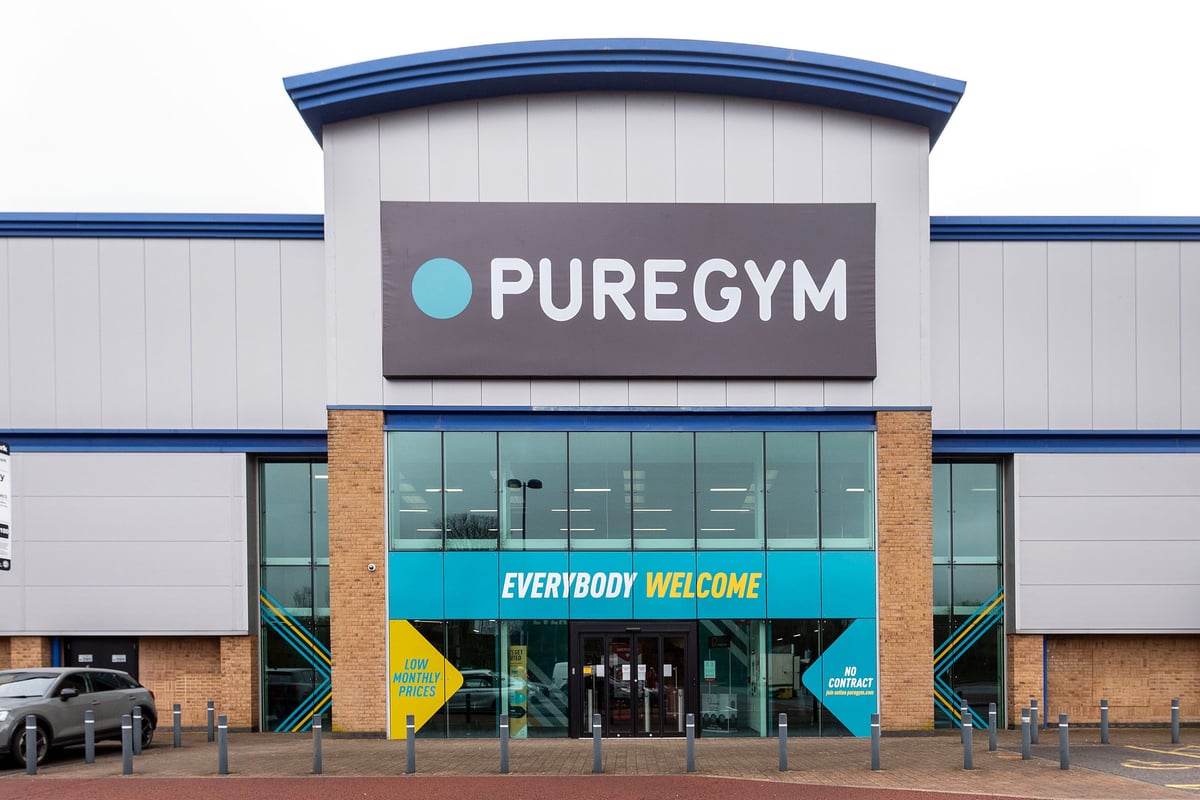 PureGym Caerphilly: Gym building exterior showing company branding and 'Everybody Welcome' signage.