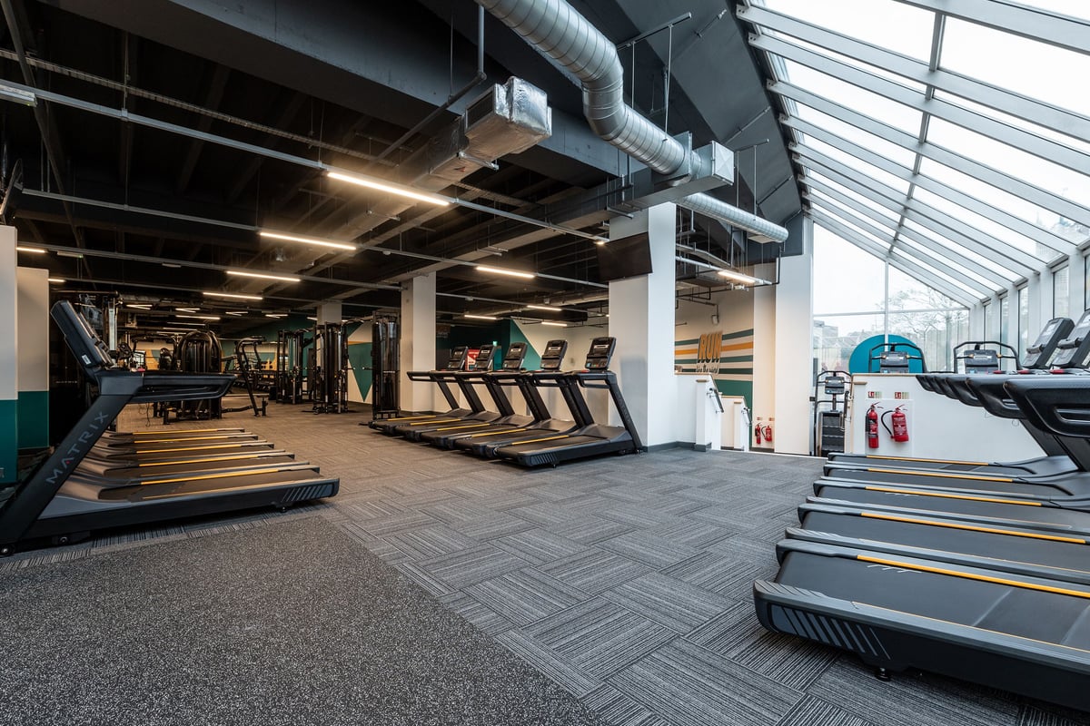 PureGym Ipswich Buttermarket: Rows of treadmills, stairmasters, and exercise equipment in a modern gym interior.
