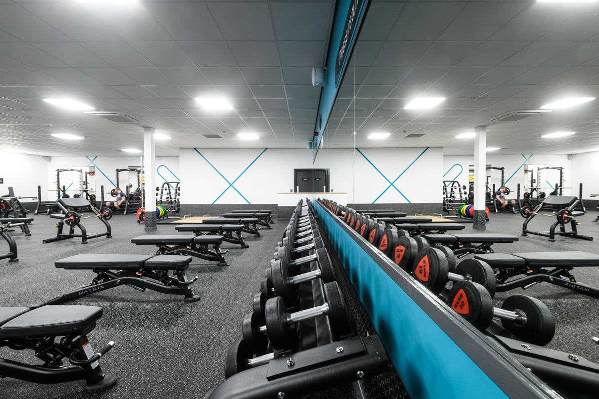 PureGym Southend Fossetts Park: Weight benches, dumbbells, squat racks, rubberised floors, cable machines in a gym interior.