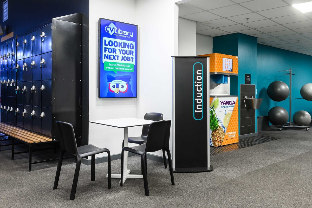 PureGym Glasgow Shawlands: Lockers, induction area and sports water machine in a gym.