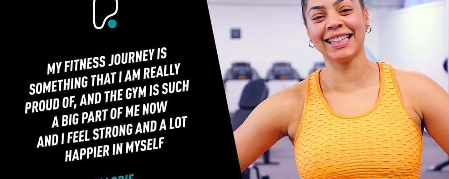 Smiling woman in orange sportswear standing in gym with exercise machines in background
