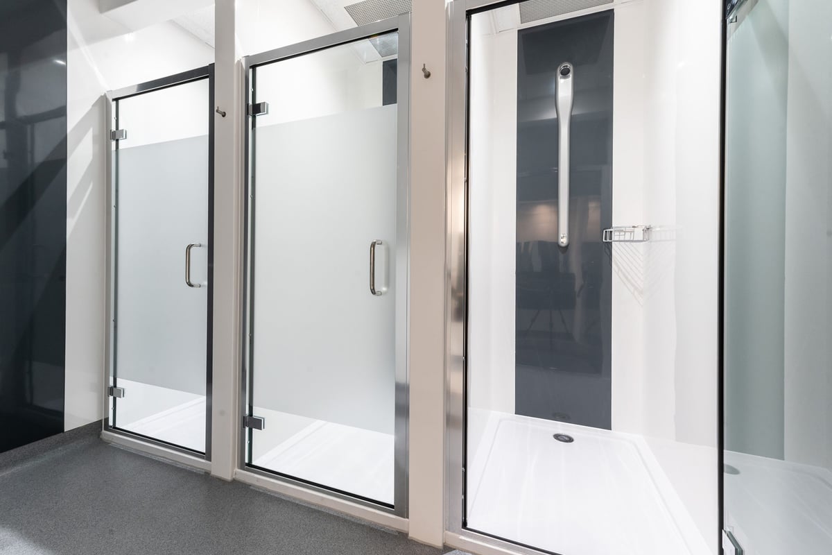 PureGym Bicester: Enclosed shower stalls with frosted glass doors.