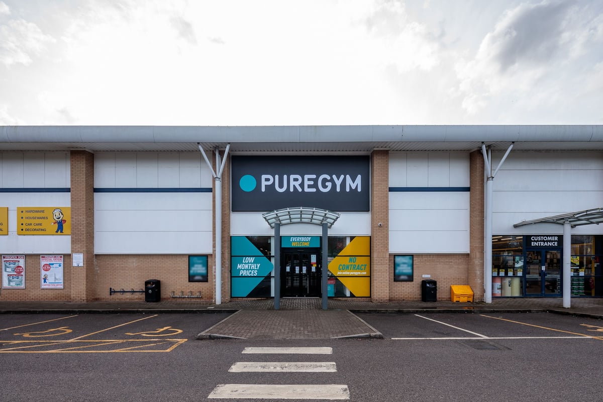 PureGym Frome: Pure gym exterior with entrance, parking spaces, and storefront signage.