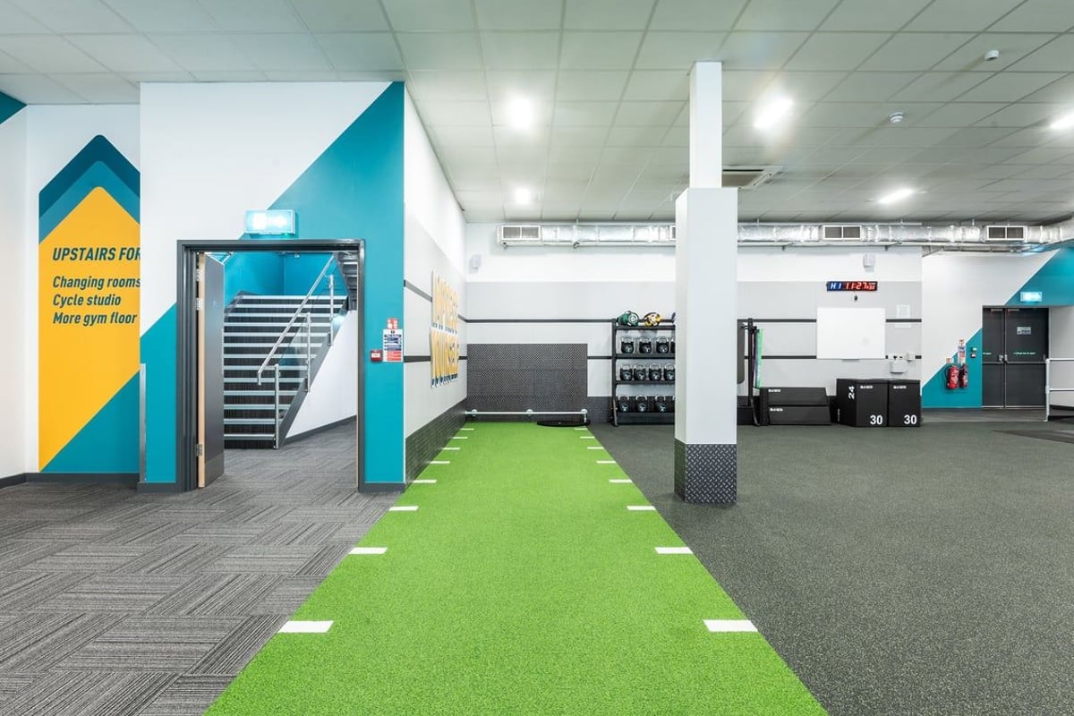 PureGym Coventry Warwickshire Shopping Park: Functional training area with kettlebells, turf, and ploymetric jump boxes.