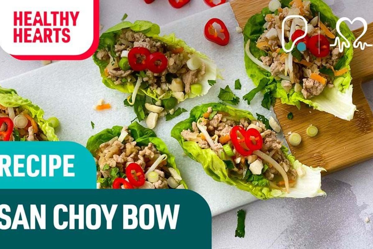 Lettuce cups filled with minced meat, chopped vegetables, and sliced red chili peppers