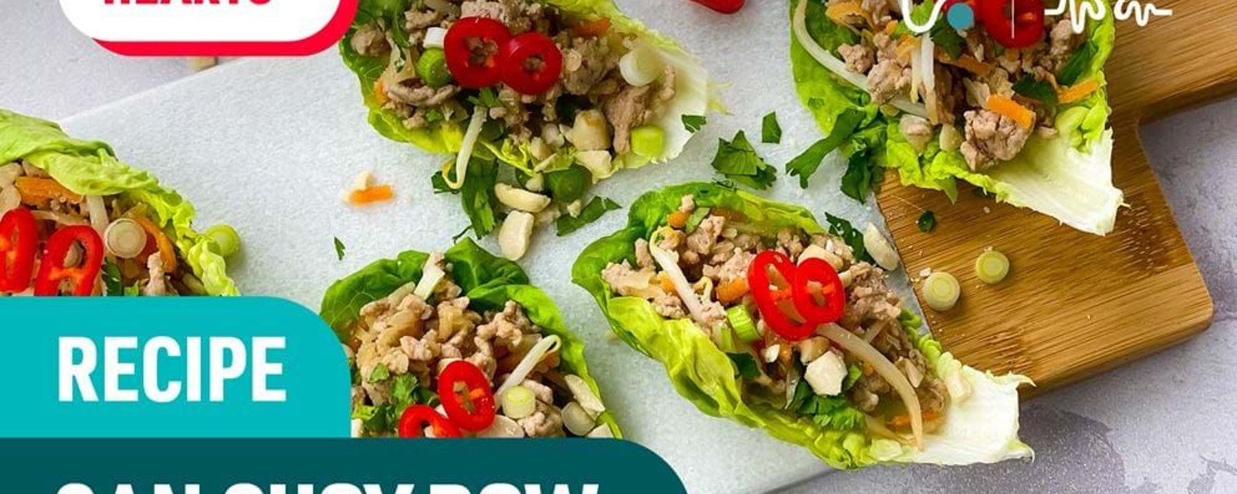 Lettuce cups filled with minced meat, chopped vegetables, and sliced red chili peppers