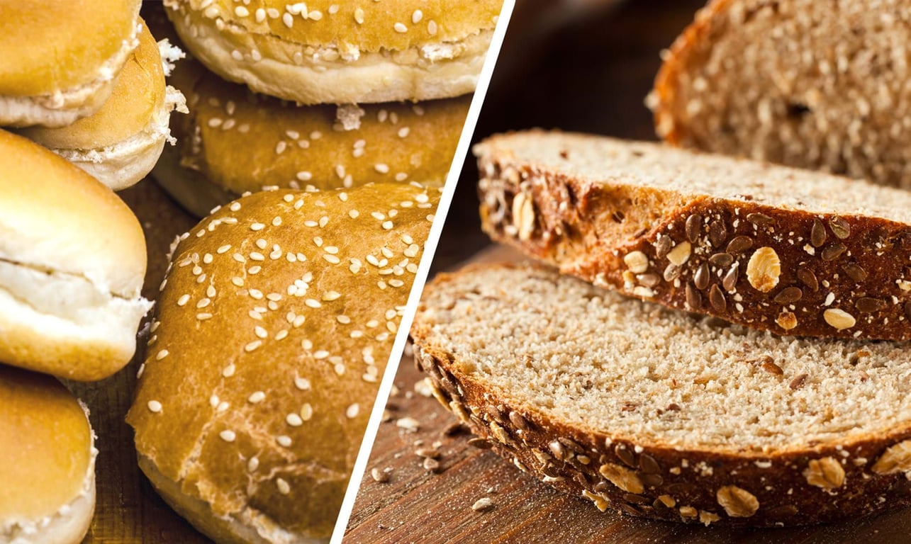Assorted bread rolls with sesame seeds and sliced whole grain bread with seeds