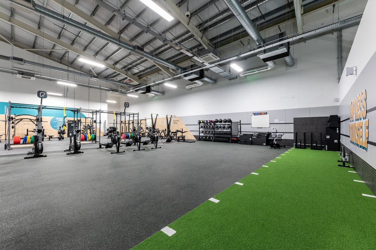 PureGym Lincoln Carlton Centre: Floor space with weightlifting equipment, turf training area and weight racks.