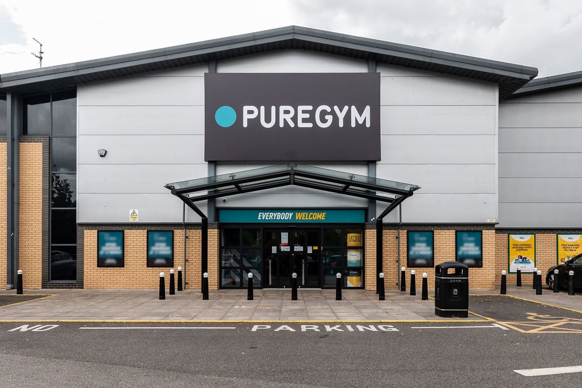 PureGym Byfleet: Gym building exterior with parking spaces and entrance canopy.