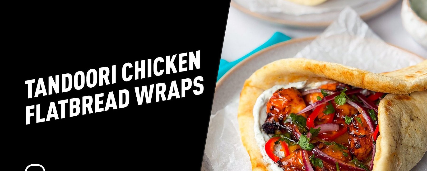 Tandoori chicken with red onions, chillies, and herbs in flatbread wraps on plates