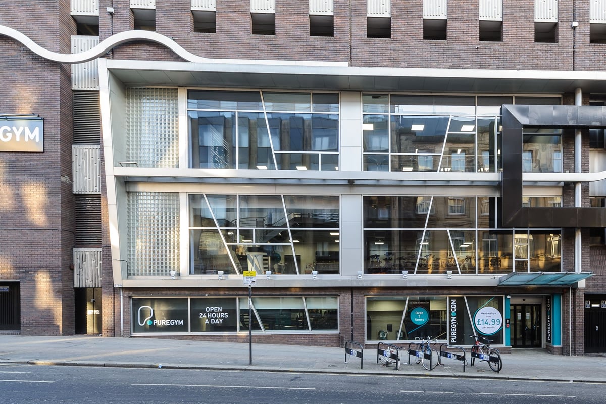 PureGym Glasgow Bath Street: Gym exterior with large windows displaying exercise equipment inside.