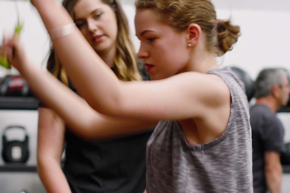 Charlotte, a PureGym member with cerebral palsy, training at the gym