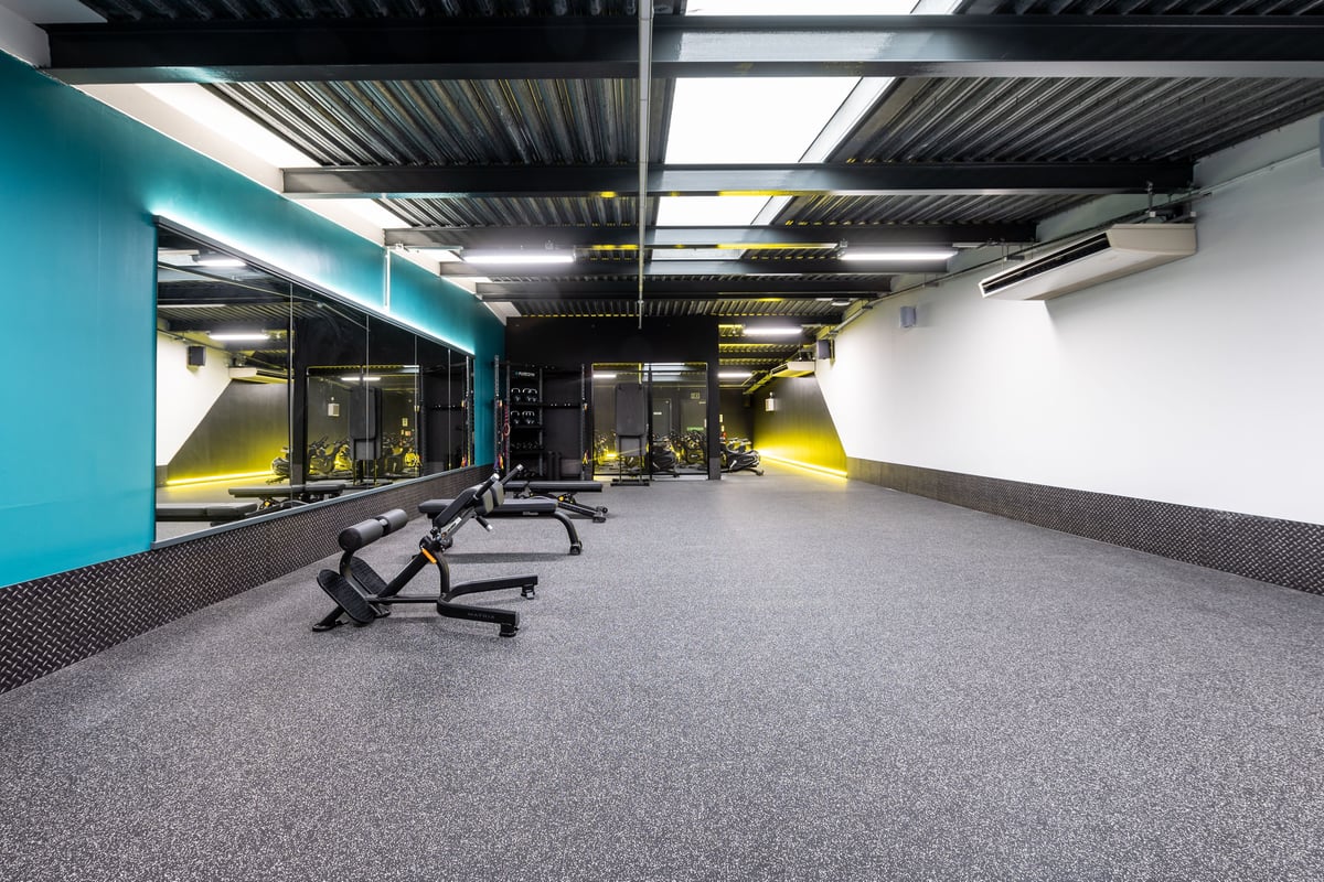 PureGym BradfordIdle - Benches on a rubberised gym floor