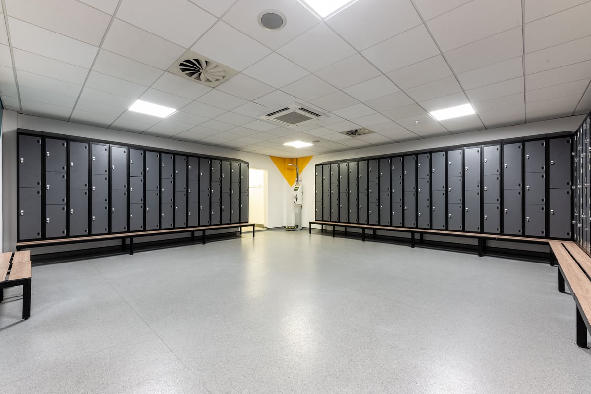 PureGym London Edgware: Rows of lockers along the walls, typical of a changing room interior.