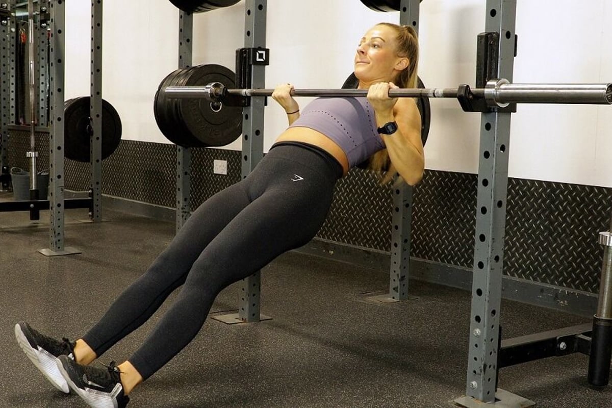 woman doing an inverted row