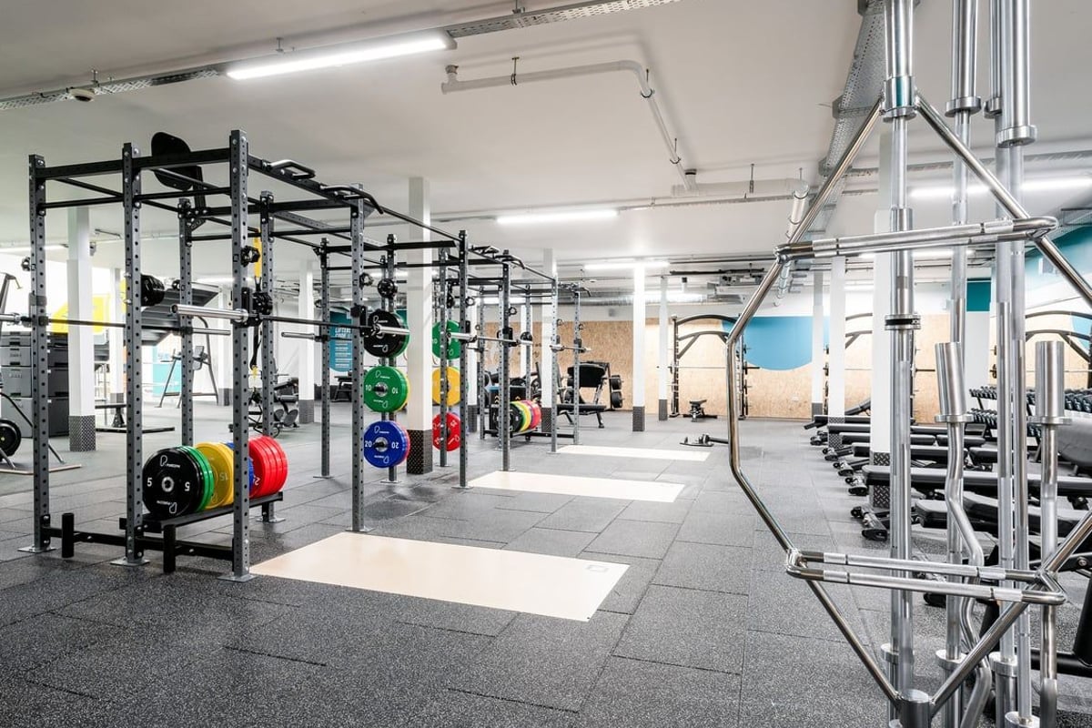 PureGym Cannock Orbital Retail Park: Squat racks, weightlifting platforms, barbells, weight plates, and rubberized flooring.