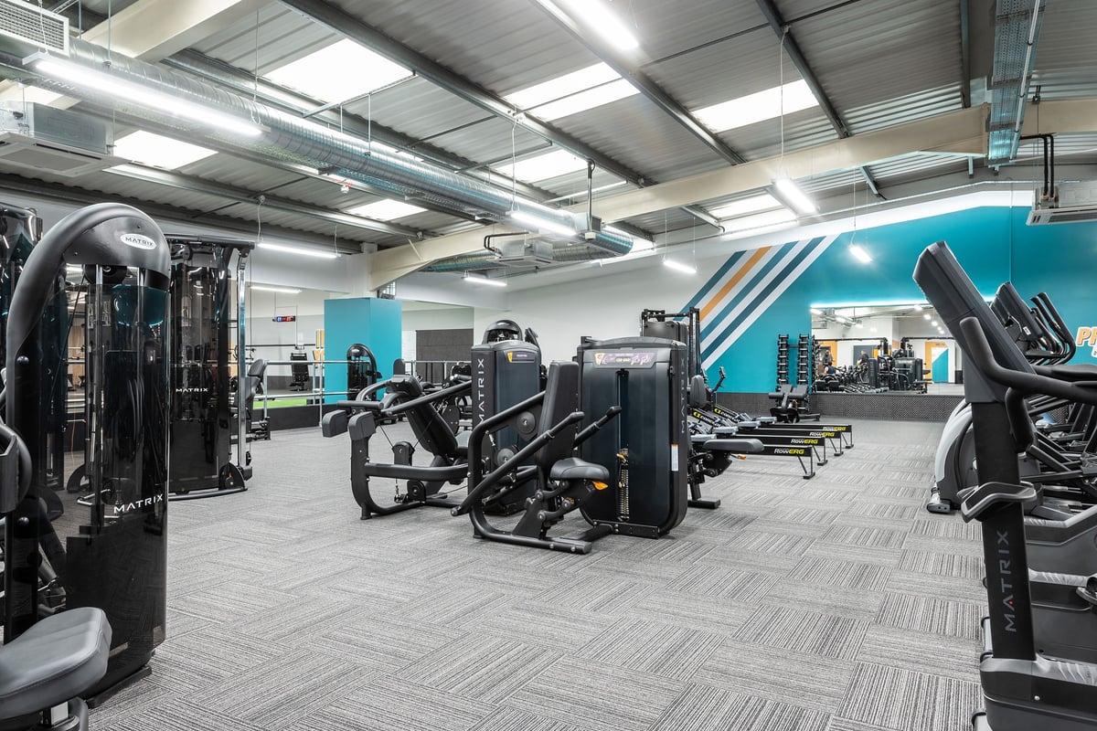 PureGym Cardiff Western Avenue: Weight machines, resistance equipment, rubberized flooring, and mirrored walls.