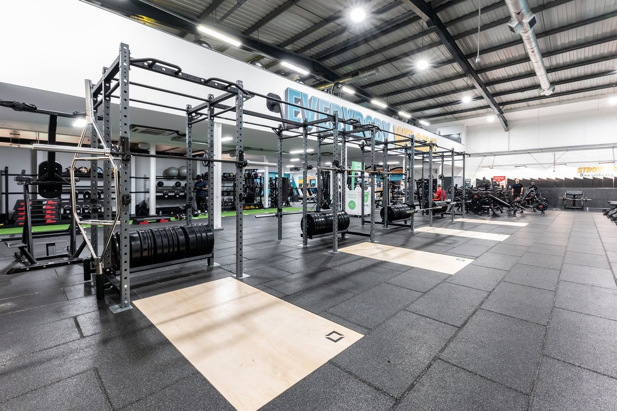 PureGym West Thurrock: Free weight racks, resistance machines, rubberized floors in a large gym facility.