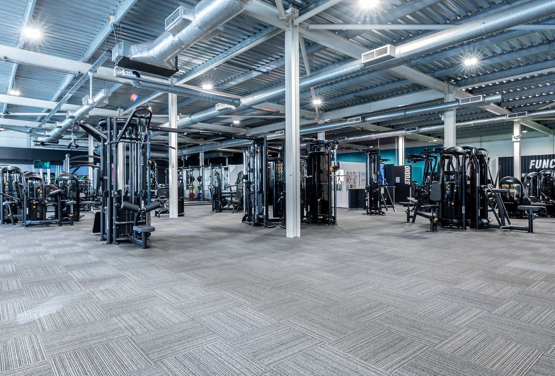 PureGym Bristol Union Gate: Gym interior with weight machines, free weights, mirrors, and rubberized flooring visible.