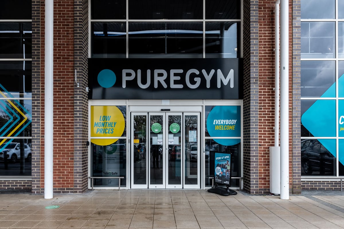 PureGym Bournemouth Mallard Road Retail Park: Entrance with glass doors, brick exterior, and everybody welcome signage.