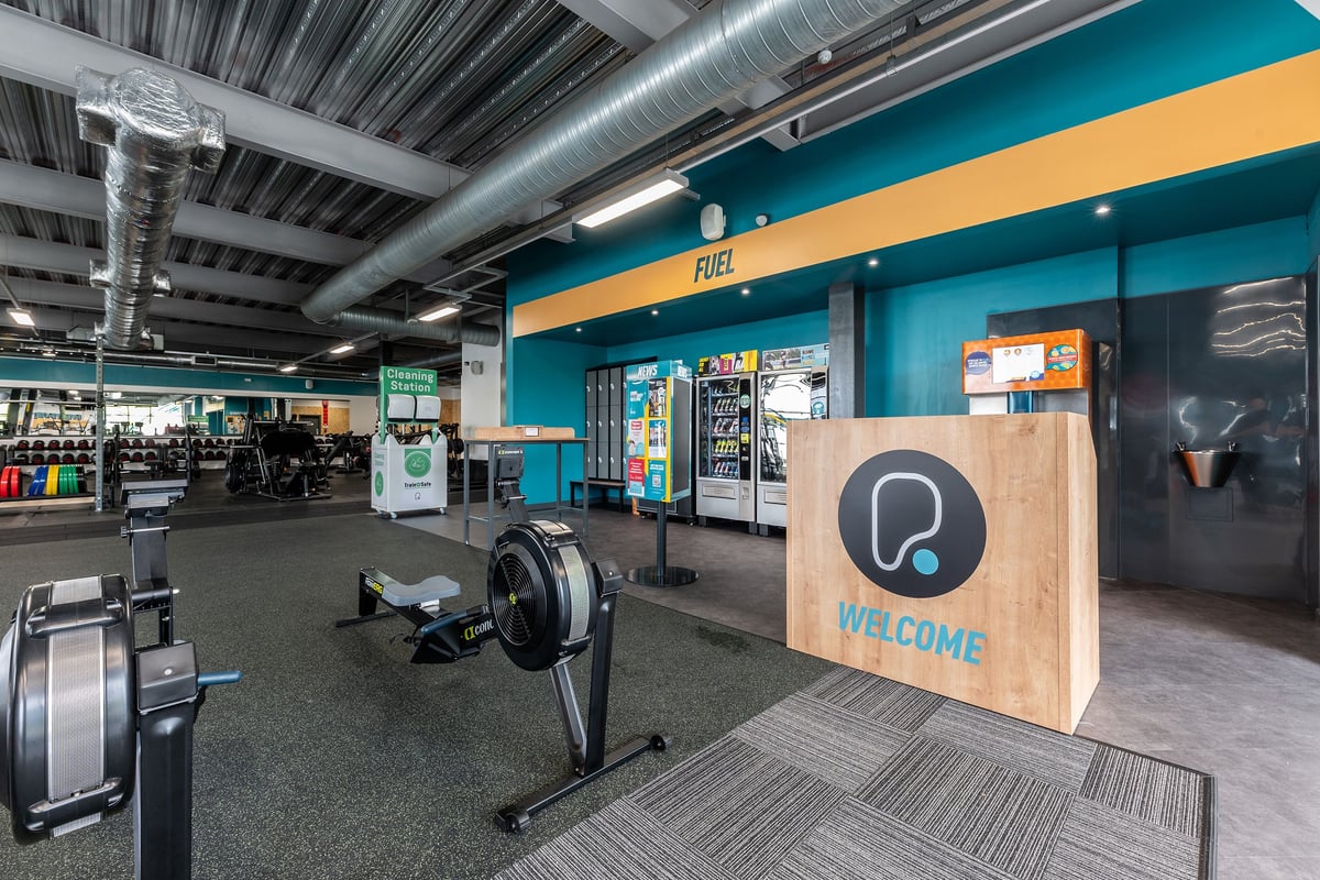 PureGym Reading Basingstoke Road: Treadmills, weight benches, free weights, and vending machines.