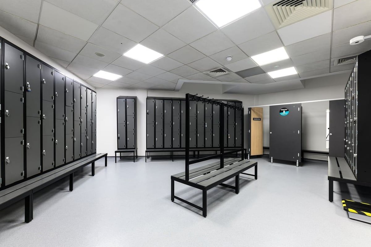 PureGym Norwich Riverside: Rows of lockers, benches, providing secure storage and changing facilities.