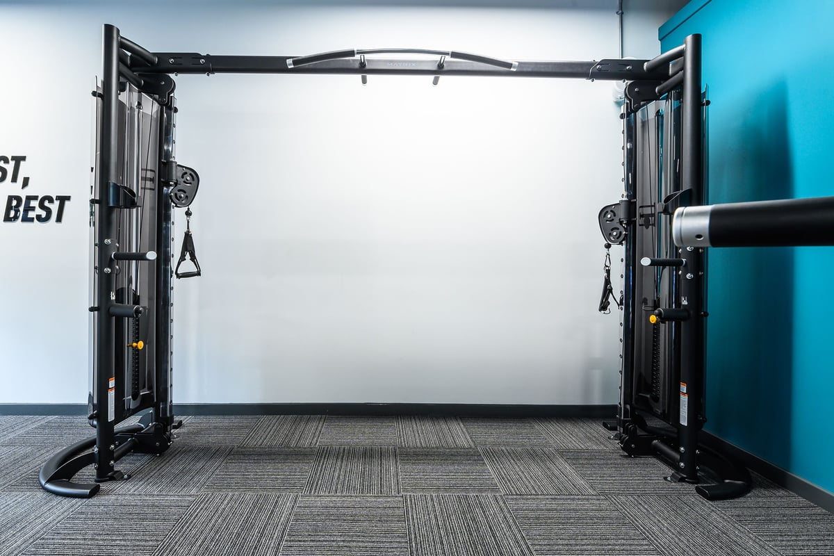 PureGym London Camberwell Southampton Way: Functional training rig with adjustable cable pulleys, rubberized flooring tiles.