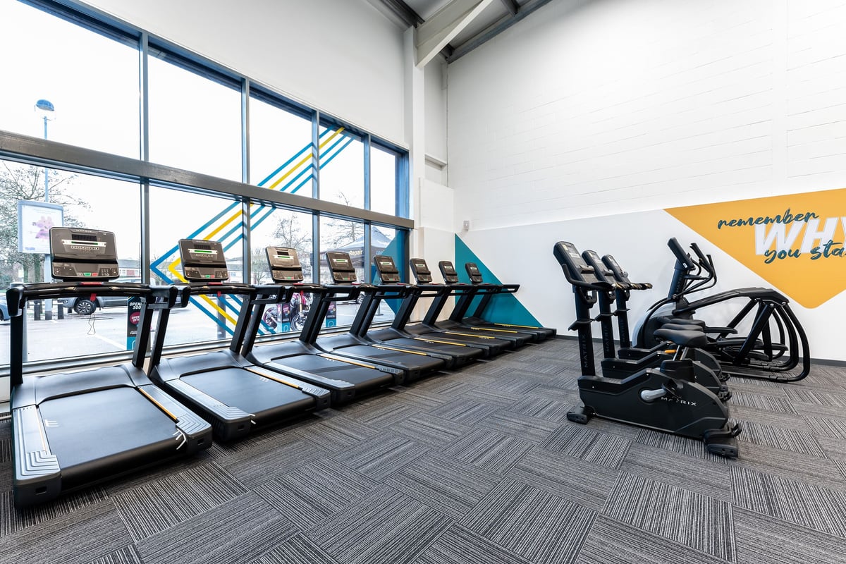 PureGym Maidenhead: Rows of treadmills and exercise bikes inside a bright gym space.