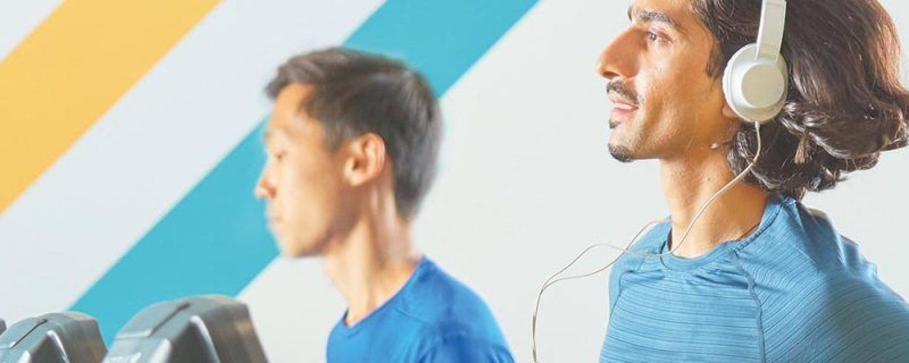 PureGym: 3 members jogging on treadmills